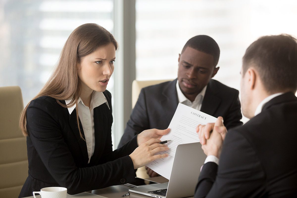 Legal advisors assisting an employer during a workplace misconduct investigation meeting.